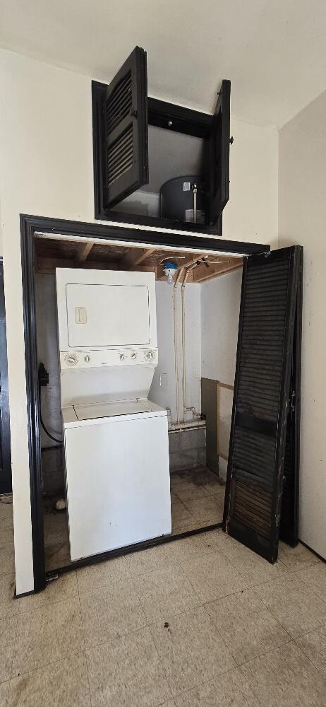 4997 S Croton Hardy Dr, Newaygo, MI 49337 - washroom featuring stacked washer / dryer