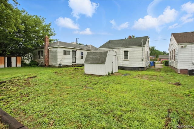 3887 Moore Ave, Allen Park, MI 48141 - back of property featuring a storage shed and a yard