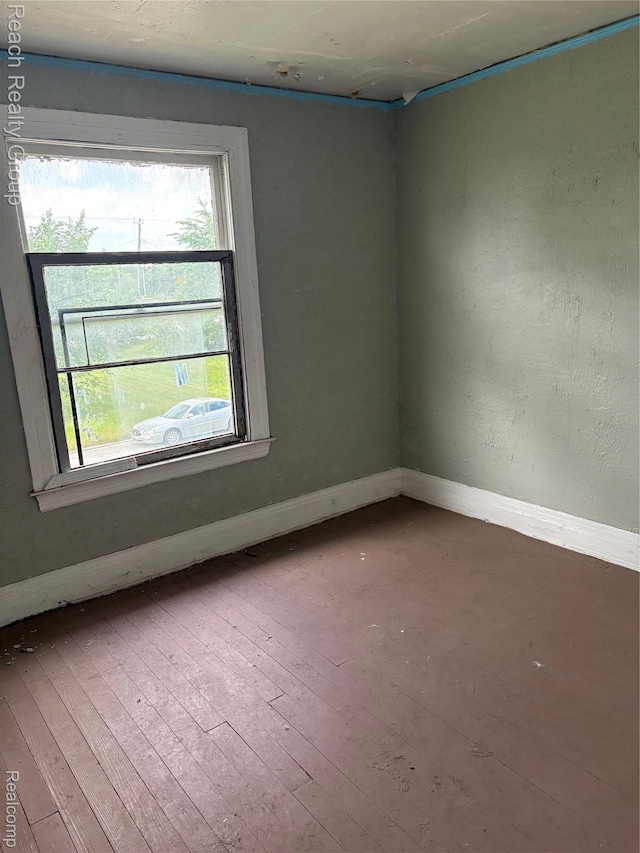 199 Waverly St, Highland Park, MI 48203 - unfurnished room with healthy amount of natural light and hardwood / wood-style floors