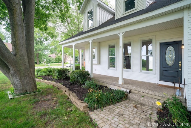 401 Erin Isle Ct, Holland, MI 49424 - view of exterior entry featuring a porch