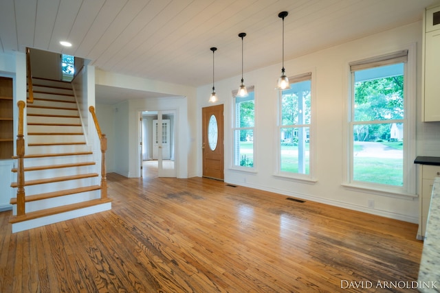 401 Erin Isle Ct, Holland, MI 49424 - entryway featuring wood finished floors and stairway