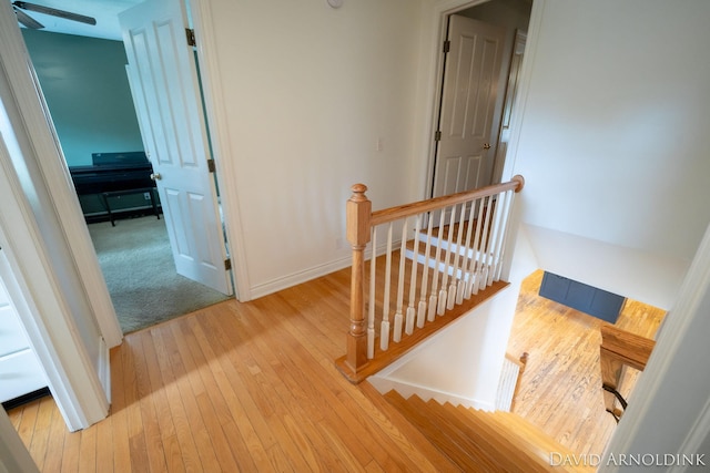 401 Erin Isle Ct, Holland, MI 49424 - staircase featuring wood-type flooring and baseboards