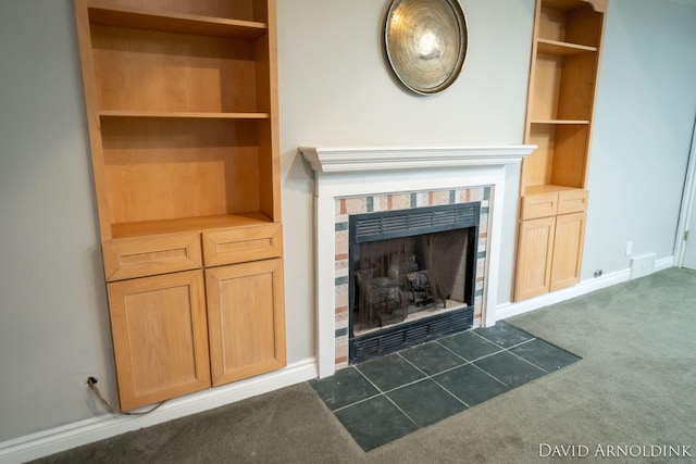 401 Erin Isle Ct, Holland, MI 49424 - detailed view of carpet and a fireplace with flush hearth