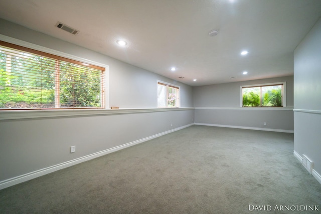 401 Erin Isle Ct, Holland, MI 49424 - spare room featuring carpet floors, healthy amount of natural light, recessed lighting, and a smoke detector
