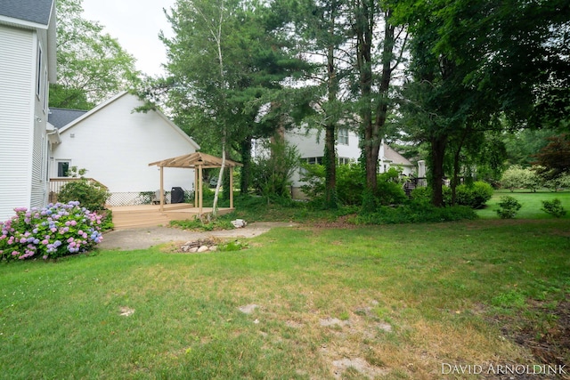 401 Erin Isle Ct, Holland, MI 49424 - view of green lawn with a wooden deck