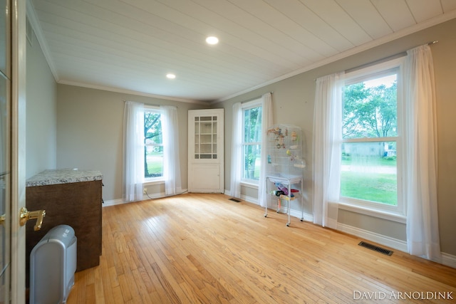 401 Erin Isle Ct, Holland, MI 49424 - spare room with crown molding, light wood-style floors, and recessed lighting