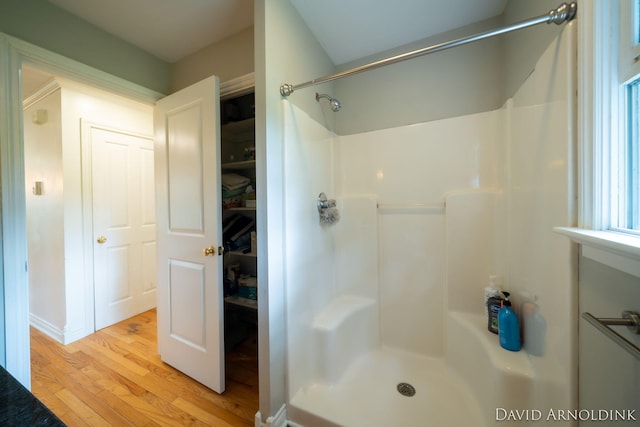401 Erin Isle Ct, Holland, MI 49424 - bathroom featuring wood finished floors and a shower