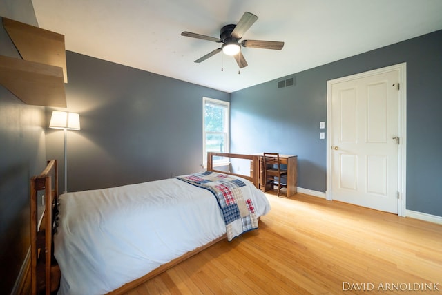 401 Erin Isle Ct, Holland, MI 49424 - bedroom featuring light wood-style floors and a ceiling fan