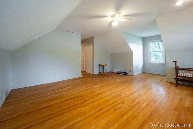401 Erin Isle Ct, Holland, MI 49424 - additional living space featuring vaulted ceiling, light wood-type flooring, and ceiling fan