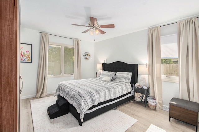10850 Rajah Dr, Zeeland, MI 49464 - bedroom featuring light wood-type flooring and ceiling fan