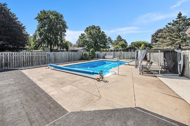 10850 Rajah Dr, Zeeland, MI 49464 - view of pool with a fenced backyard, a patio area, and a diving board