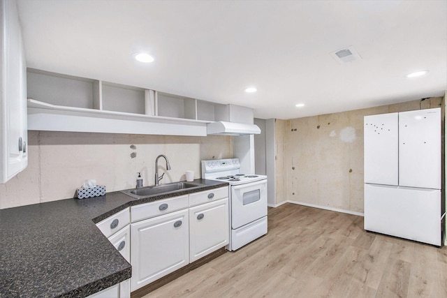10850 Rajah Dr, Zeeland, MI 49464 - kitchen featuring white appliances, dark countertops, open shelves, premium range hood, and white cabinets