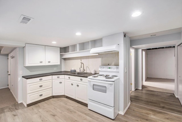 10850 Rajah Dr, Zeeland, MI 49464 - kitchen with electric stove, open shelves, custom range hood, white cabinetry, and recessed lighting