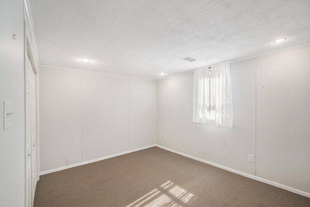10850 Rajah Dr, Zeeland, MI 49464 - carpeted spare room with a textured ceiling and recessed lighting