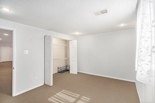 10850 Rajah Dr, Zeeland, MI 49464 - unfurnished bedroom featuring carpet flooring, recessed lighting, crown molding, a textured ceiling, and a closet