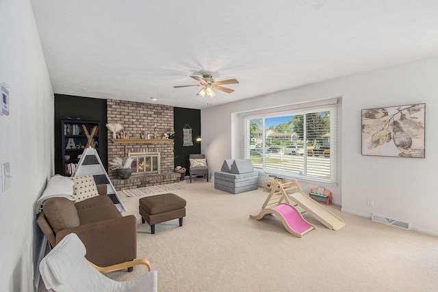 10850 Rajah Dr, Zeeland, MI 49464 - living room with carpet flooring, ceiling fan, and a fireplace