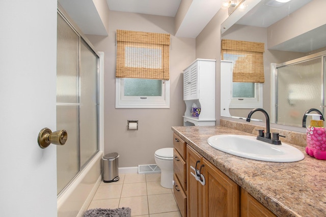 10850 Rajah Dr, Zeeland, MI 49464 - full bathroom featuring vanity, tile patterned flooring, and shower / bath combination with glass door