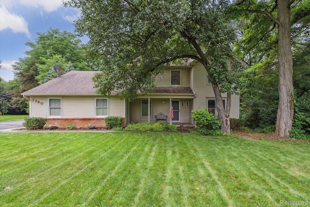 7740 Athlone Dr, Brighton, MI 48116 - view of front of property featuring a front yard and brick siding
