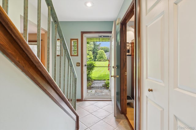 7740 Athlone Dr, Brighton, MI 48116 - foyer with light tile patterned floors, recessed lighting, and stairs