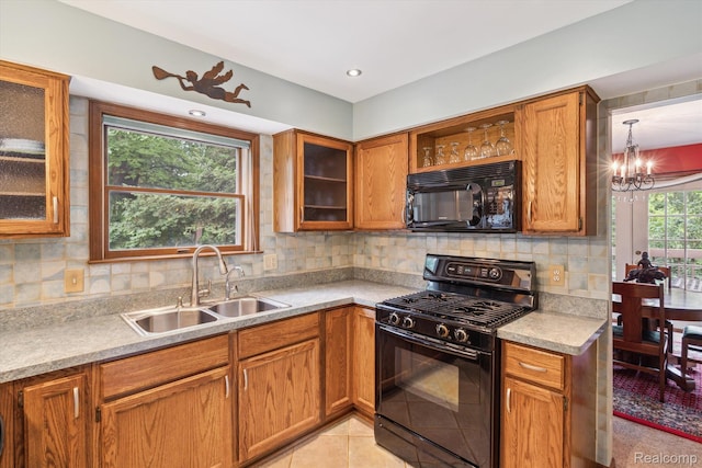 7740 Athlone Dr, Brighton, MI 48116 - kitchen with black appliances, brown cabinetry, tasteful backsplash, and glass insert cabinets
