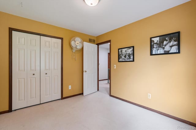 7740 Athlone Dr, Brighton, MI 48116 - unfurnished bedroom featuring light colored carpet and a closet