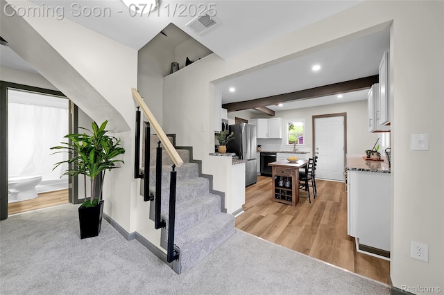 313 W Harwood Ave, Madison Heights, MI 48071 - staircase with wood finished floors and recessed lighting