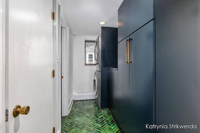 1217 El Camino Dr NW, Grand Rapids, MI 49504 - hall featuring stacked washer / dryer