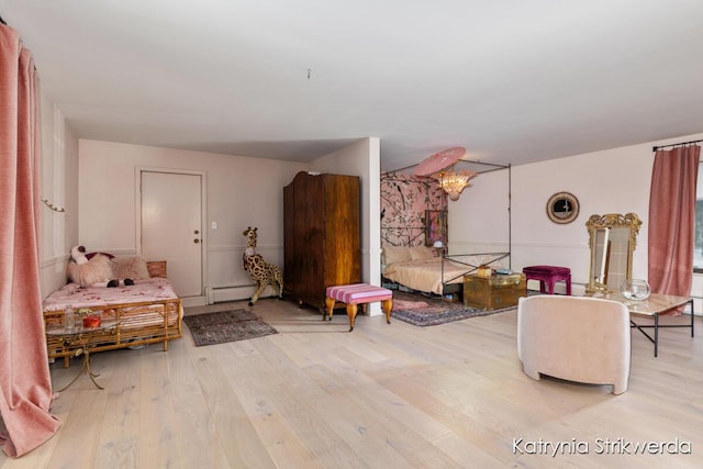 1217 El Camino Dr NW, Grand Rapids, MI 49504 - living area with baseboard heating and wood-type flooring