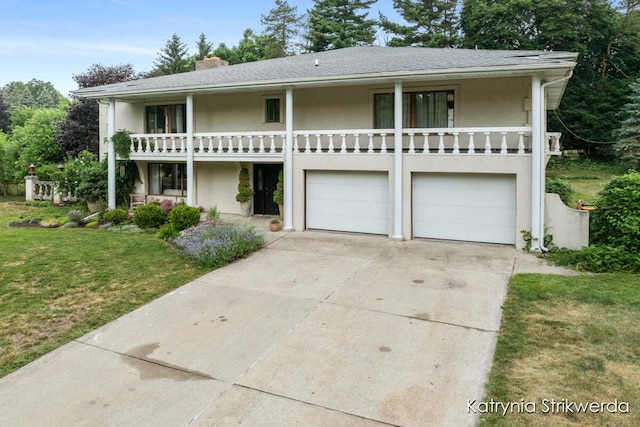 1217 El Camino Dr NW, Grand Rapids, MI 49504 - view of front of house with stucco siding, an attached garage, concrete driveway, a front lawn, and a chimney