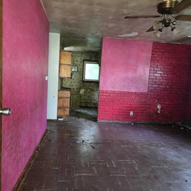 709 11th St, Three Rivers, MI 49093 - unfurnished living room featuring ceiling fan and baseboards