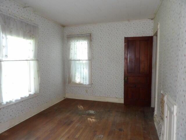 209 E High St, Union City, MI 49094 - spare room featuring hardwood / wood-style flooring