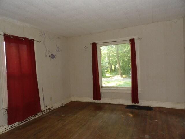 209 E High St, Union City, MI 49094 - unfurnished room featuring wood finished floors and baseboards