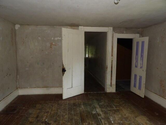 209 E High St, Union City, MI 49094 - empty room with hardwood / wood-style floors and baseboards