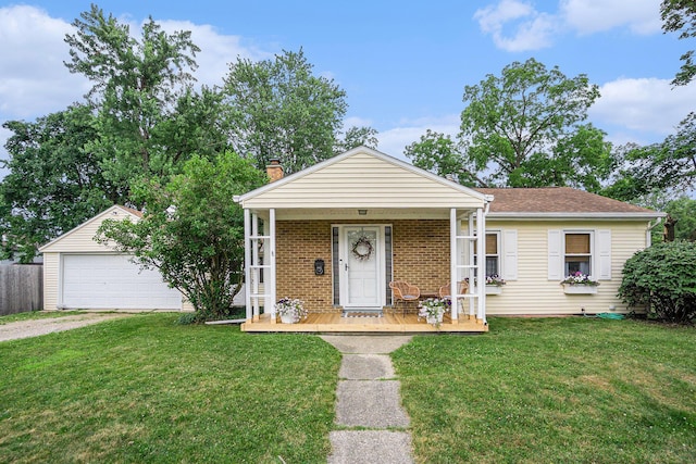 1805 Cambridge Dr, Kalamazoo, MI 49001 - view of front of home featuring covered porch, a front yard, a garage, and brick siding