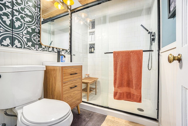 1805 Cambridge Dr, Kalamazoo, MI 49001 - bathroom featuring a stall shower, a wainscoted wall, and vanity