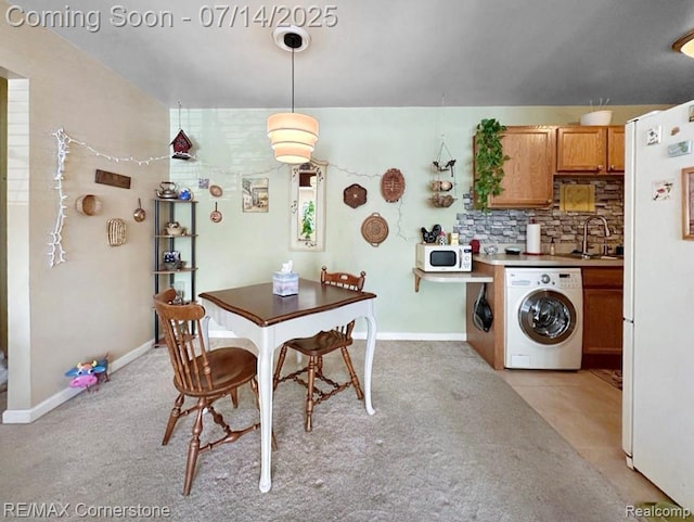 7382 Central St Unit 4, Westland, MI 48185 - dining area with washer and clothes dryer and light carpet