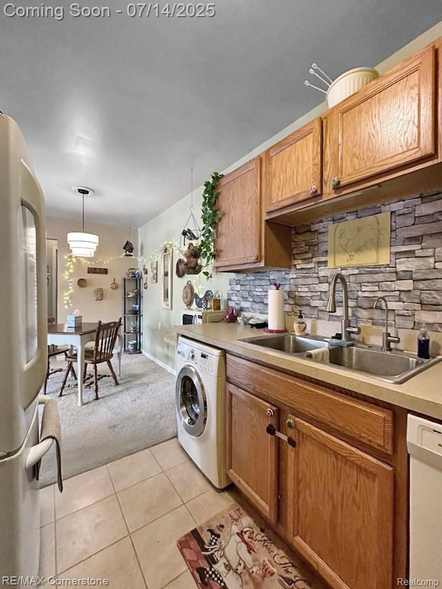 7382 Central St Unit 4, Westland, MI 48185 - kitchen with washer / dryer, white appliances, light tile patterned floors, light carpet, and backsplash