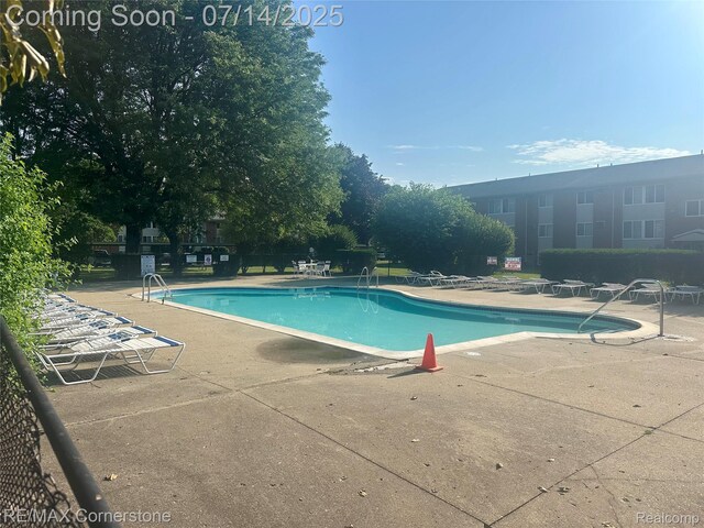 7382 Central St Unit 4, Westland, MI 48185 - community pool with a patio area
