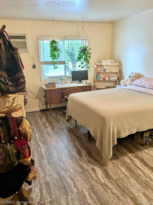7382 Central St Unit 4, Westland, MI 48185 - bedroom featuring wood finished floors, an AC wall unit, and an office area