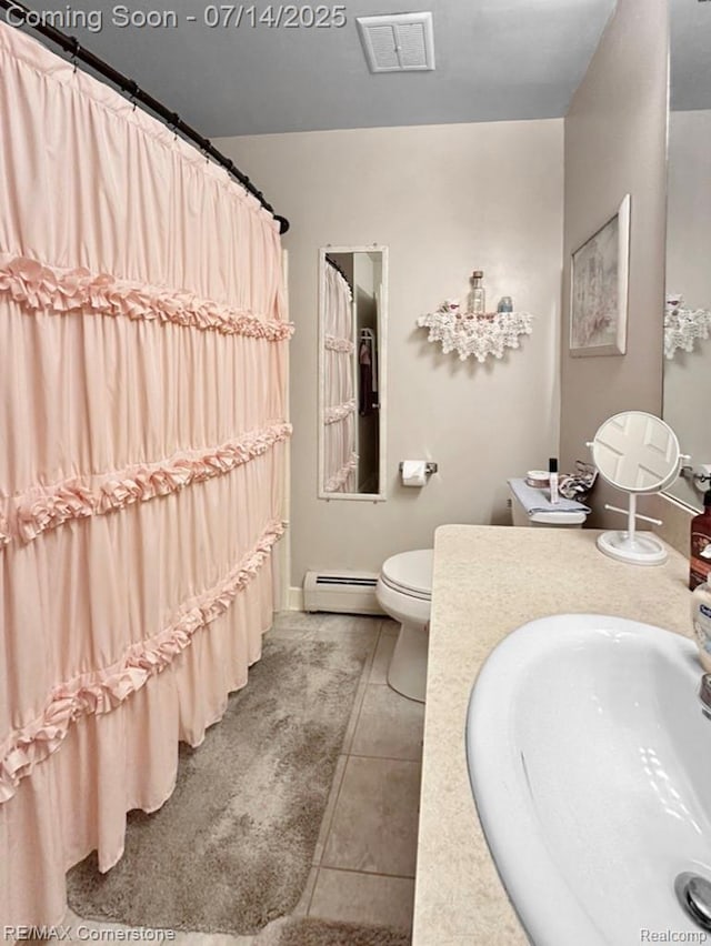 7382 Central St Unit 4, Westland, MI 48185 - full bathroom with baseboard heating, tile patterned floors, vanity, and curtained shower