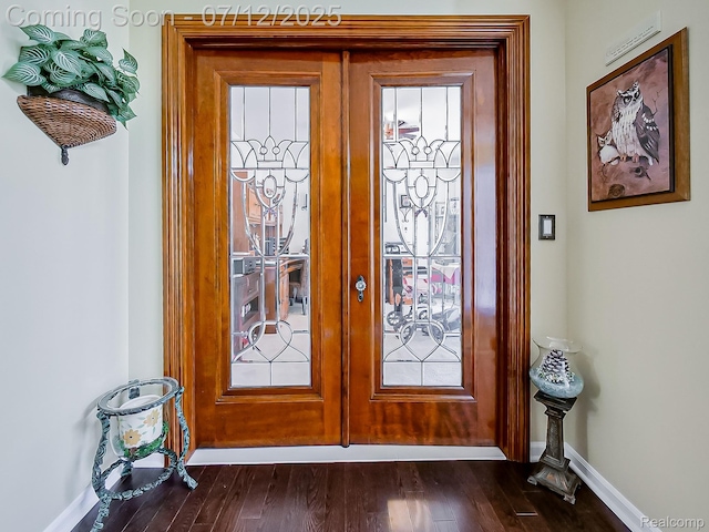 12495 Howland Park Dr, Plymouth, MI 48170 - foyer entrance with french doors and dark wood finished floors