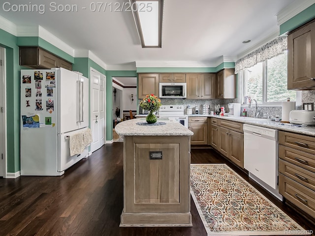 12495 Howland Park Dr, Plymouth, MI 48170 - kitchen with white appliances, a center island, tasteful backsplash, crown molding, and dark wood-type flooring