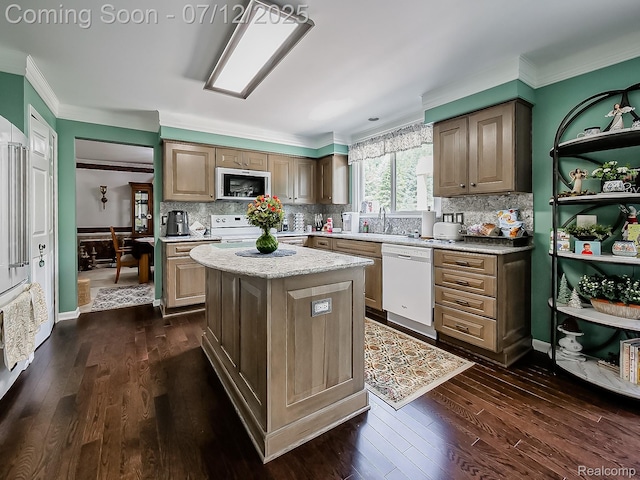 12495 Howland Park Dr, Plymouth, MI 48170 - kitchen with dishwasher, stainless steel microwave, ornamental molding, dark wood-type flooring, and a center island