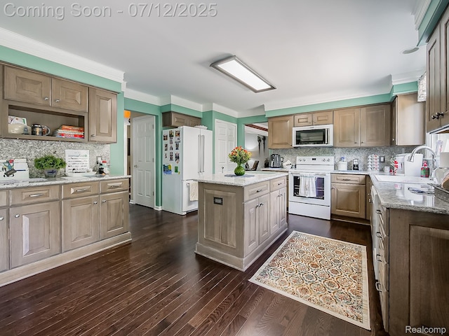 12495 Howland Park Dr, Plymouth, MI 48170 - kitchen featuring white appliances, decorative backsplash, a kitchen island, dark wood-style floors, and light stone counters