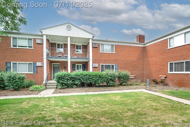 1097 Tienken Ct, Rochester Hills, MI 48306 - view of front of property featuring a balcony, a front lawn, and brick siding