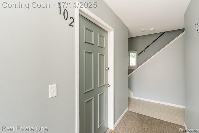 1097 Tienken Ct, Rochester Hills, MI 48306 - stairway with carpet and tile patterned floors