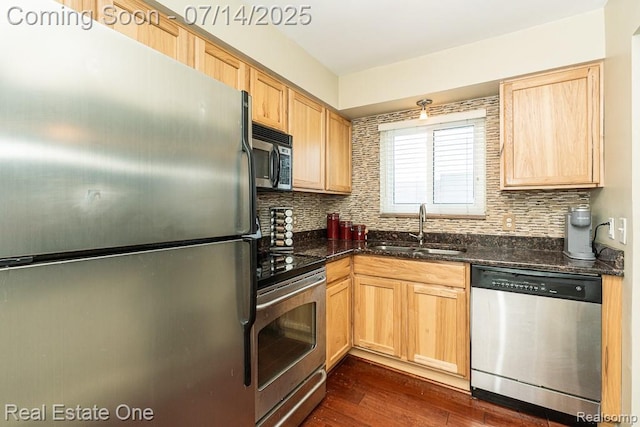 1097 Tienken Ct, Rochester Hills, MI 48306 - kitchen featuring appliances with stainless steel finishes, light brown cabinetry, backsplash, dark wood finished floors, and dark stone countertops