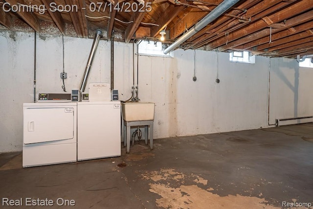 1097 Tienken Ct, Rochester Hills, MI 48306 - basement with washing machine and clothes dryer and a baseboard heating unit