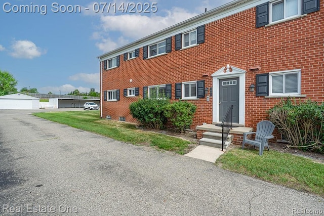 1097 Tienken Ct, Rochester Hills, MI 48306 - colonial inspired home with brick siding and an outbuilding
