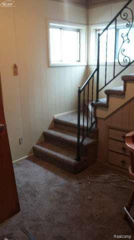 1702 Nebraska Ave, Flint, MI 48506 - stairway featuring carpet floors